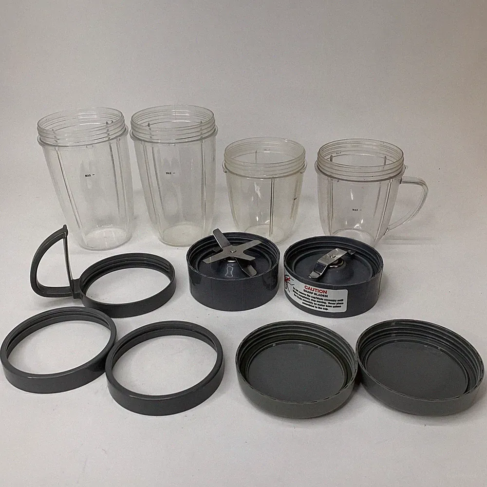 Large 11 Pc lot of Nutribullet replacement parts cups, blade, lids, handles
