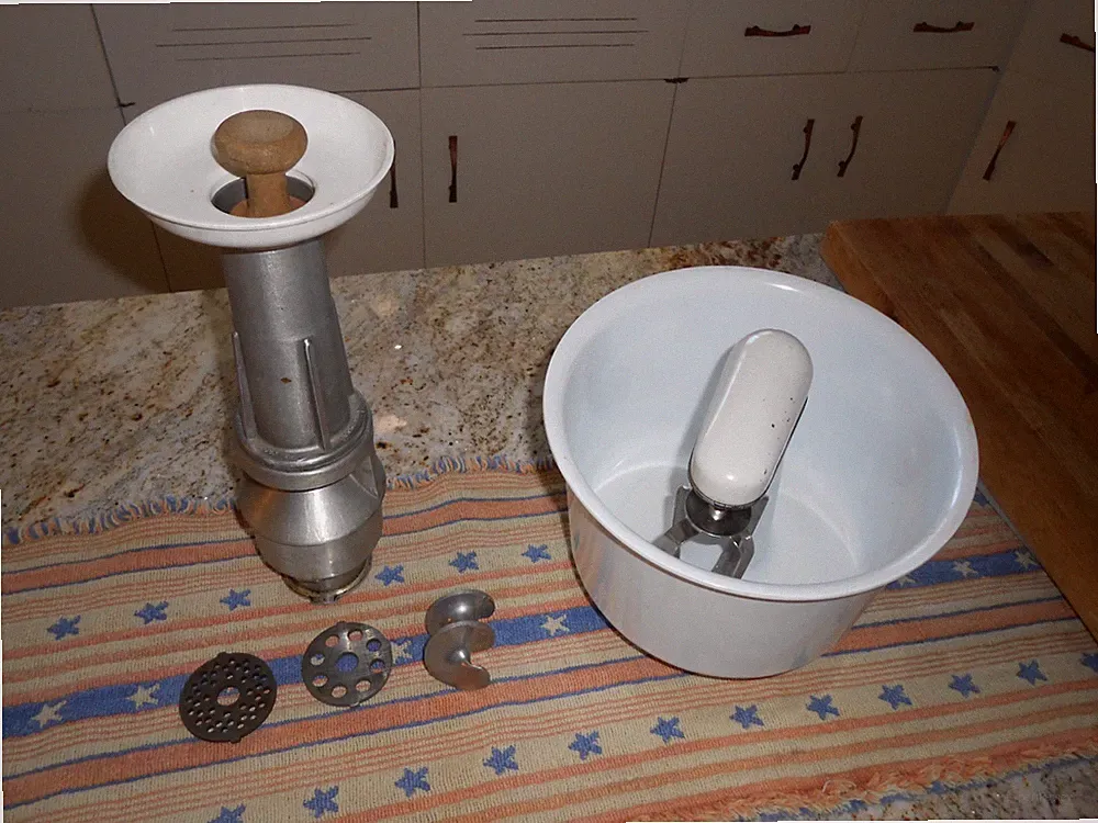 vintage NuTone built-in food center attachment set includes a meat grinder and a
